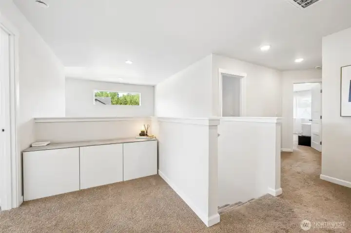 This storage cabinet stays with the home. It fits perfect in this loft area.