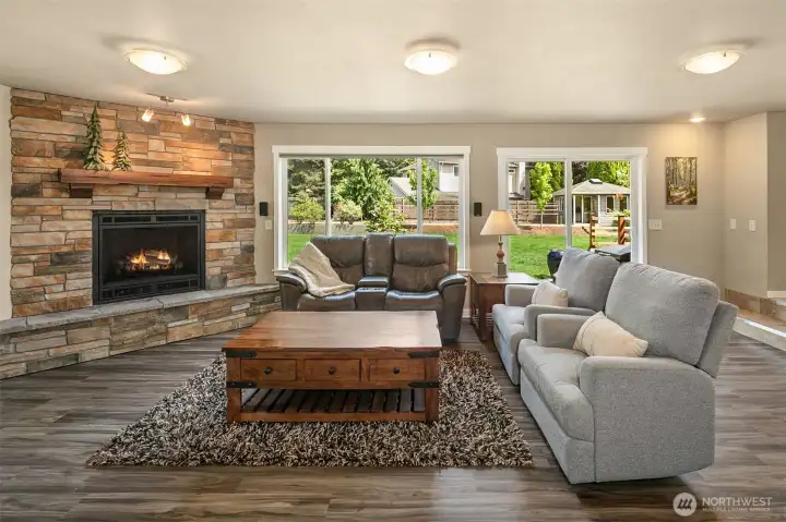 Family room with big windows, natural light and 3 doors out to back yard