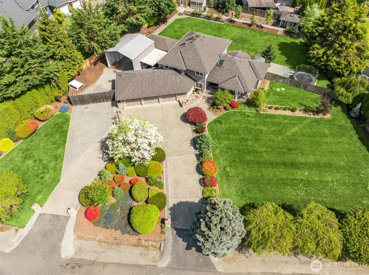 Large usable lot, tons of parking, ffenced back yard, mature landscaping, privacy, this home has it all