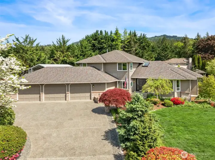 Flat, circular driveway and 3 car garage