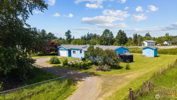 Privately set back off the street with level 1.68 acres, 2 car garage with shop, and RV parking. Privately set back off the street with level 1.68 acres, 2 car garage with shop, and RV parking.