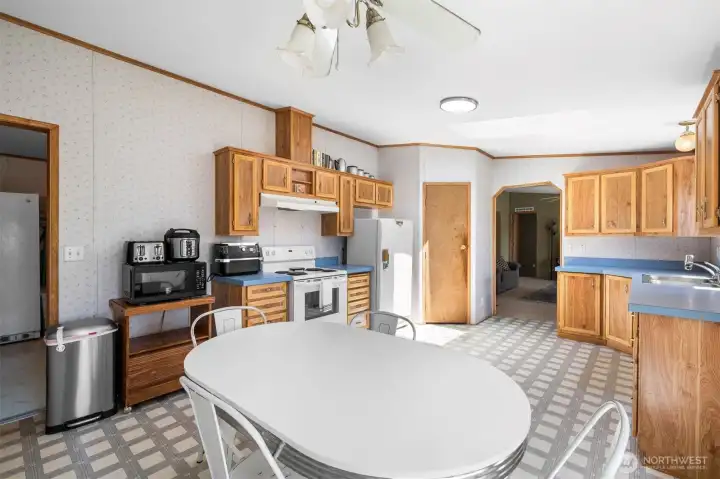 The kitchen is expansive! Large dining room area, walk-in pantry, and tons of storage! The kitchen is expansive! Large dining room area, walk-in pantry, and tons of storage!