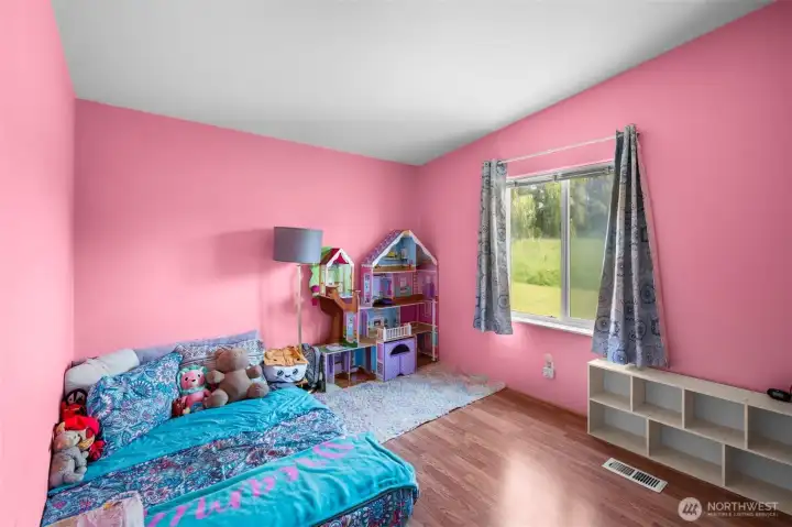 Third bedroom with a peaceful view and newer laminate flooring. Third bedroom with a peaceful view and newer laminate flooring.