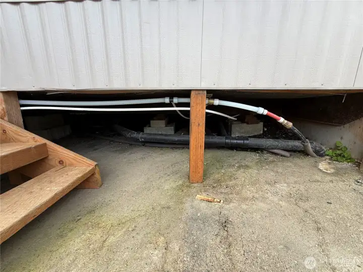 New plumbing under front of home