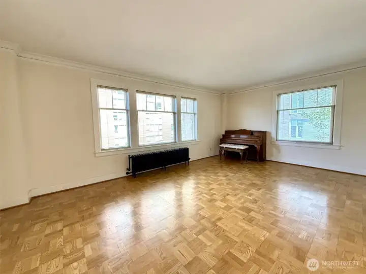 Current living room with parquet floors.