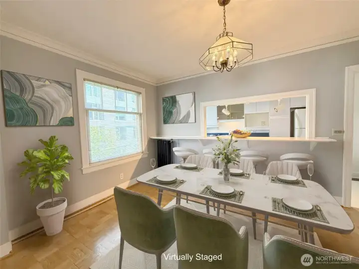 Large formal dining room with natural light.