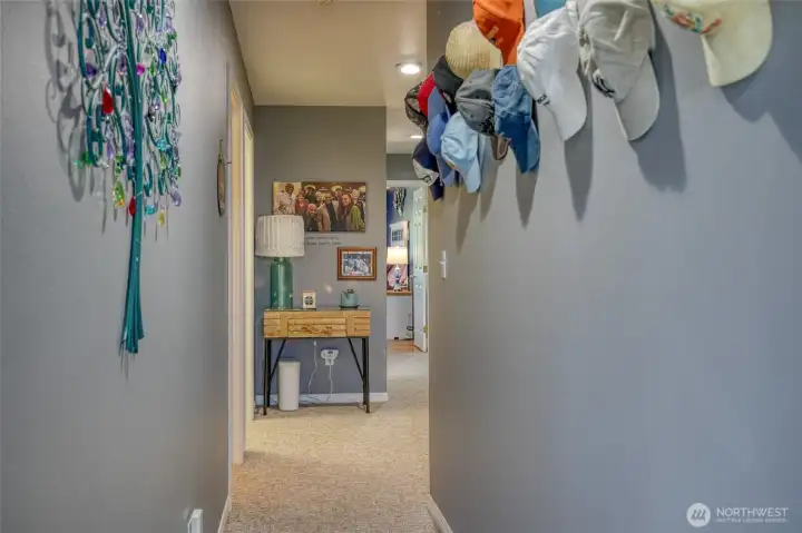 Downstairs hallway with Laundry room and mud room with freezers Downstairs hallway with Laundry room and mud room with freezers