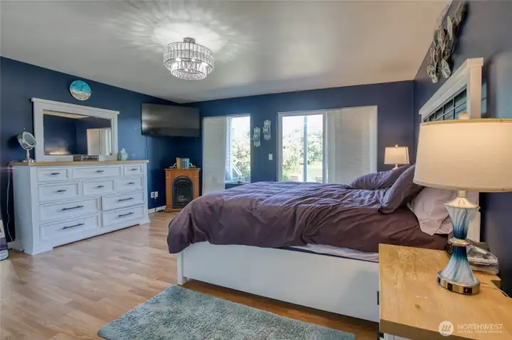 Large downstairs bedroom with slider to porch and canal Large downstairs bedroom with slider to porch and canal