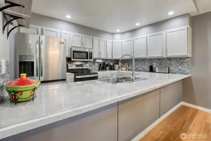 Open kitchen is light and bright with skylights Open kitchen is light and bright with skylights