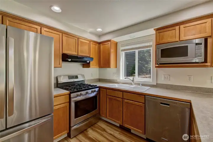 well designed kitchen with gas stove and tons of counter space. well designed kitchen with gas stove and tons of counter space.