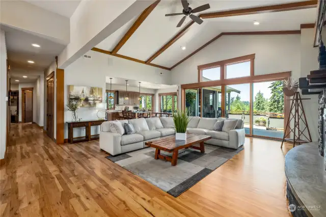 With its spacious open concept, the great room seamlessly connects to the kitchen, dining area, and exterior deck, creating a unified and inviting space for relaxation and socializing.