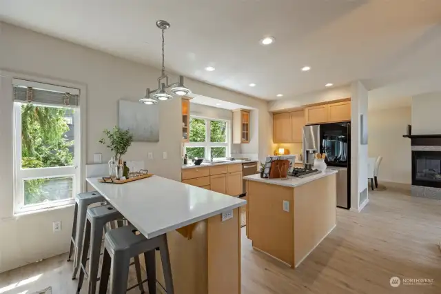 Kitchen island adds additional counter space & a wonderful place for informal dining.