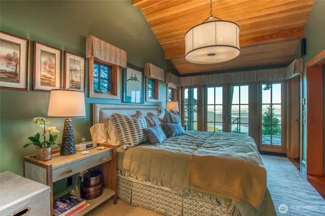Main house-primary bedroom with a view!! French doors open up to patio.