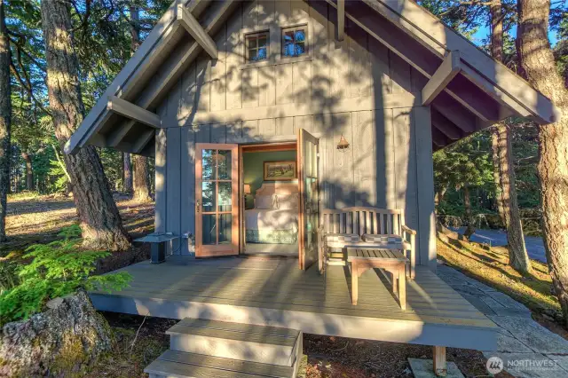 Sauna Cottage front deck and french door welcome. Stop for a minute and listen. Yes that is the sound of quiet.