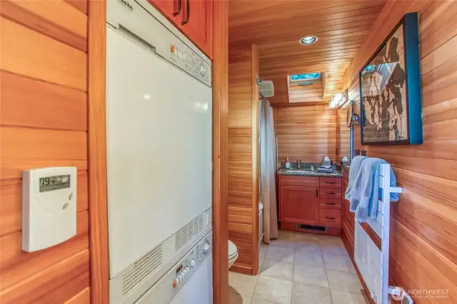 Sauna Cottage showcases ceramic tile in bathroom, shower and floor. Powder sink, new water heater, heated towel rack, natural wood finishes and Miele stackable washer/dryer.