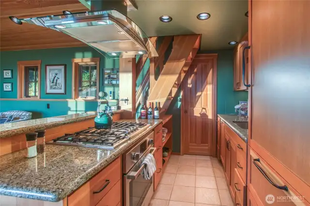 High end appliances: Miele dishwasher, Grohe kitchen faucet/sink/disposal, Bosch cooktop and oven, Miele hood. Plantry at the end wall.