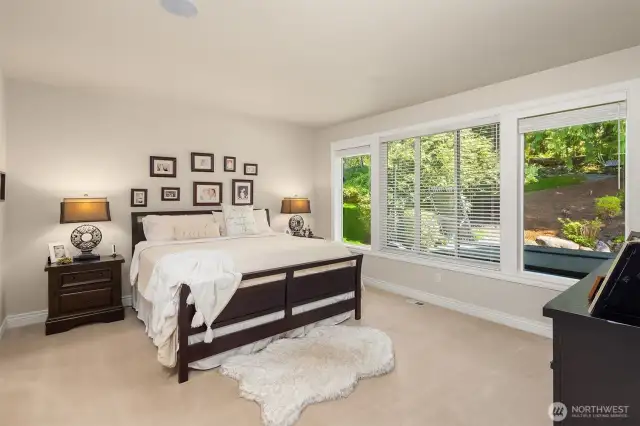 Primary bedroom on main floor with adjoining 5 piece spa bath