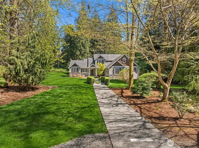 Storybook setting on shy 2 acre corner lot