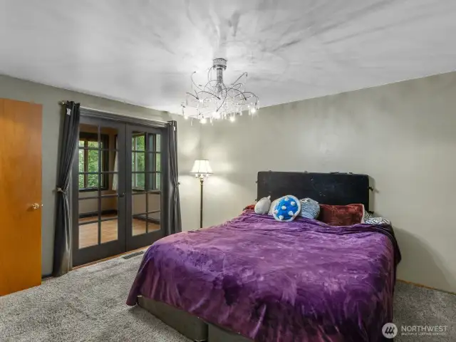 Primary suite, with french doors that lead to the sunroom