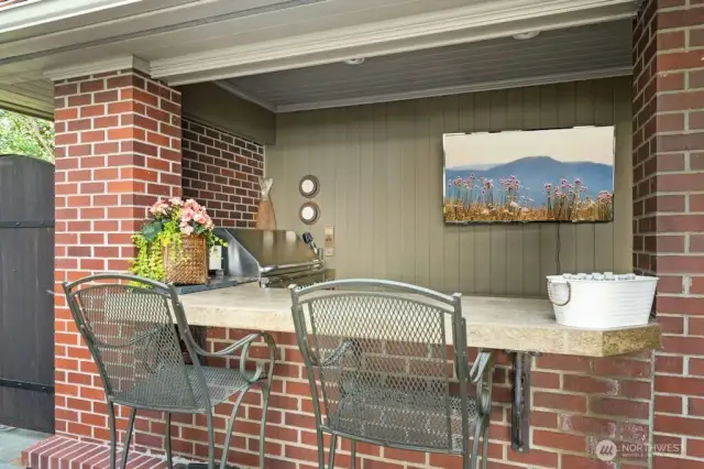 The Chef’s kitchen with oversized granite island, custom cabinets with pull out drawers offers hidden gems: trash compactor, double-oven, Sub-Zero refrigerator, undercounter lighting and floor lighting with westerly views at every turn.