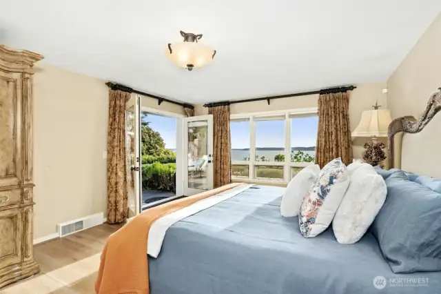 The main floor Primary Suite includes French doors to private hot tub space.