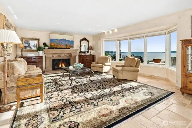 The open floorplan with decorative gas fireplace is great for entertaining or relaxing whatever the season might be.