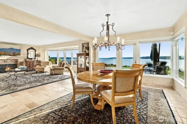 Enter through the magnificent solid wood doors, welcomed by natural stone floors and rooms filled walls of windows, that bring in the sunlight and beautiful vistas.