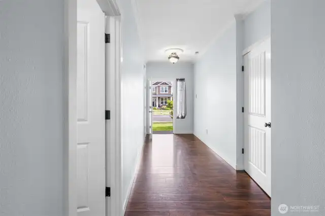 Hallway welcomes you inside, leading through to the open concept listing space.