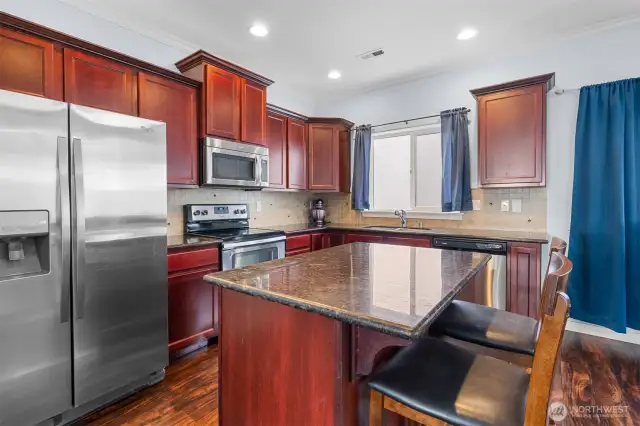 Granite counters. Full tile back splash. Recessed lighting.