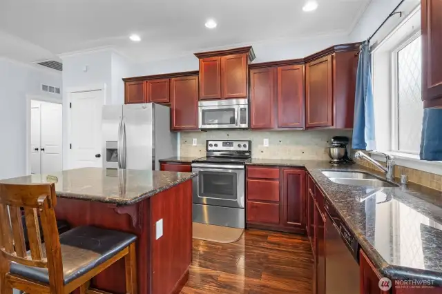 Crown molding tops the cherry cabinetry. Did you notice the pantry?