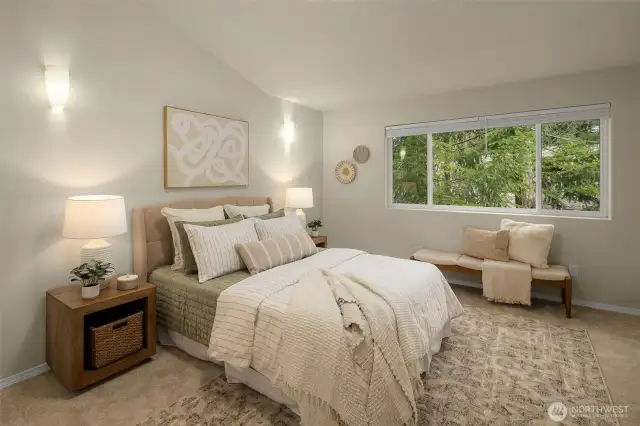 primary suite, boasting vaulted ceiling, his/her closets& a perfectly manicured en-suite bath.