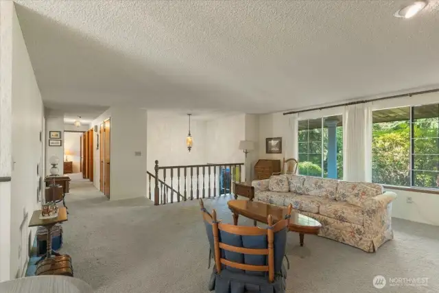 Living room - with large windows to allow natural light.
