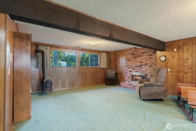 Large rec room with fireplace.