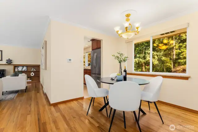Refinished hardwood floors throughout, dining area with large window and kitchen entry