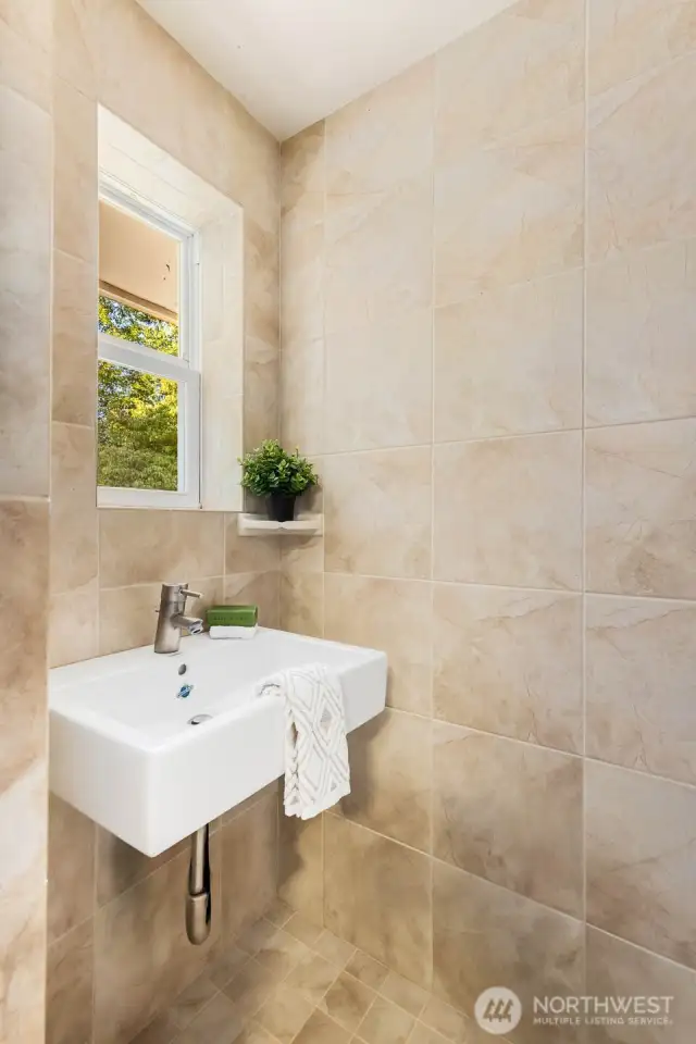 All-in-one custom primary bathroom; toilet, sink, shower in one small space