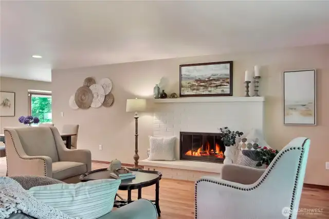Front living room with wood burning fireplace.