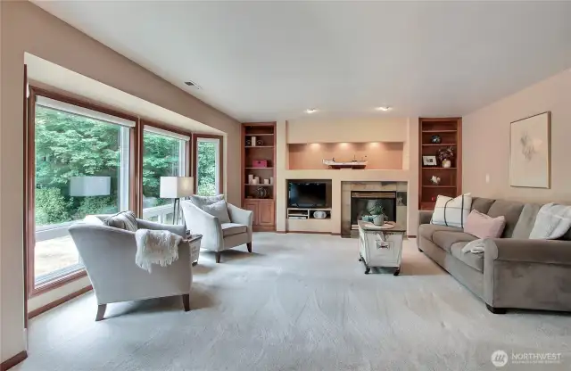 Bonus living room with custom built-ins and gas fireplace.