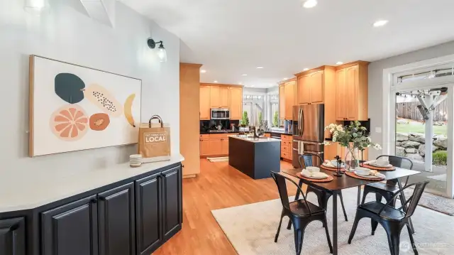 Enjoy a cozy kitchen nook perfect for your morning coffee just steps from the spacious dining area, which offers plenty of room for a large dining table close to the kitchen