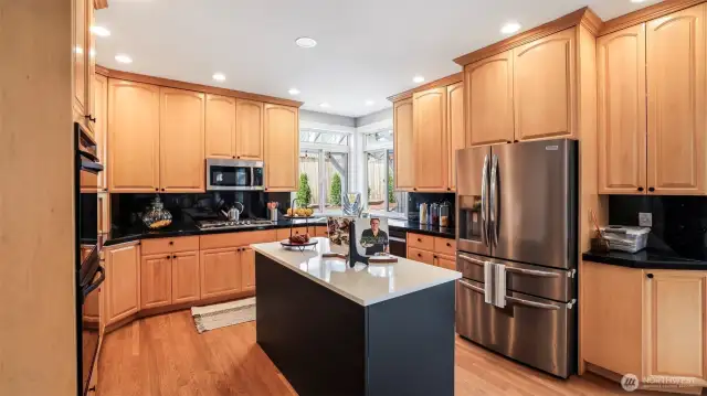 Featuring a newly painted large black island—ideal for quick meals and extra prep space—with all kitchen appliances included!