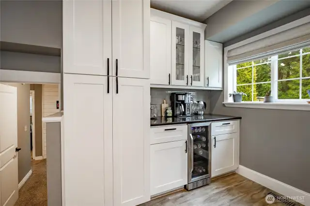 Coffee or wine anyone? Also large built in pantry cabinet & large window to enjoy your backyard view while making your favorite drink!