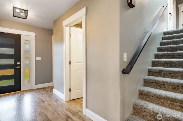 1/2 bath off entry & stairs leading to upper level
