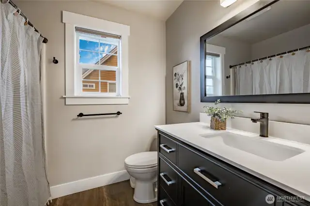 Full bathroom upstairs w/updated flooring, vanity, lighting & more