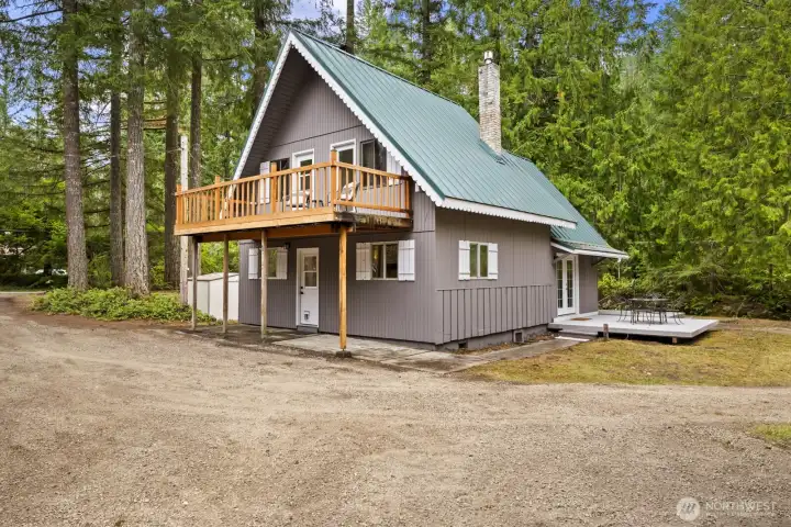 Covered back patio provides convenient access to the home.