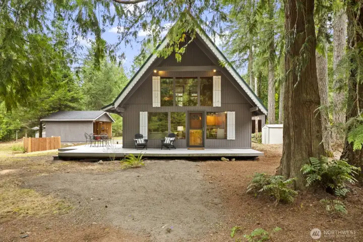 Charming curb appeal highlighted by detailed trim, shutters, and a welcoming covered front porch.