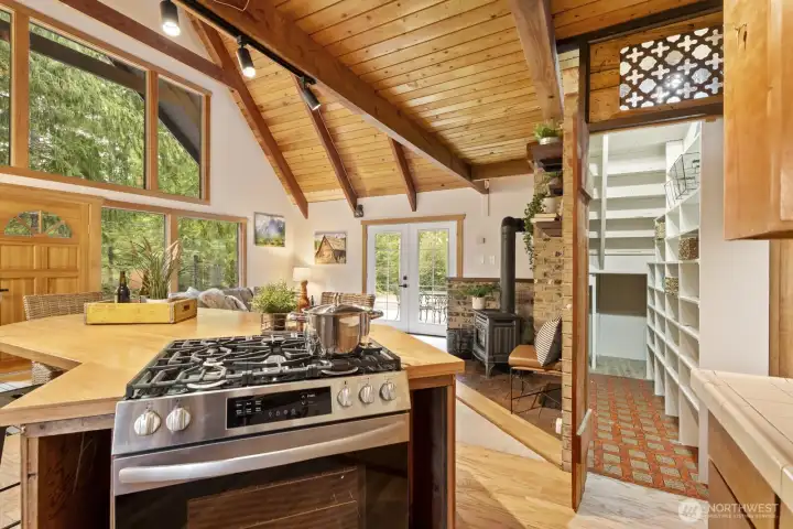 Generous walk-in pantry with built-in shelving and gas range for the home chef.