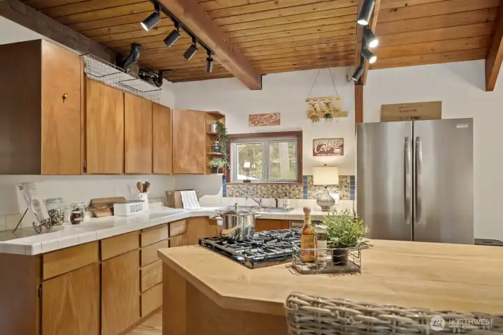 Well-appointed kitchen with plentiful storage and a generous center island for cooking and entertaining.