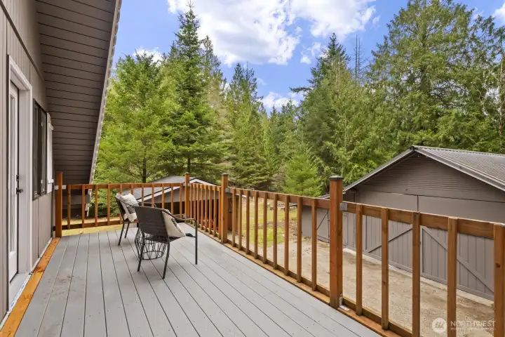 Upper-floor Trex deck with dual access from each bedroom & views of Teneriffe Falls.