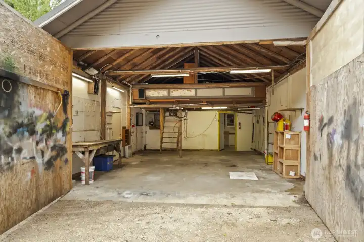 Versatile shop has dedicated electricity, air and water plumbing, and ready-to-use welder setup.