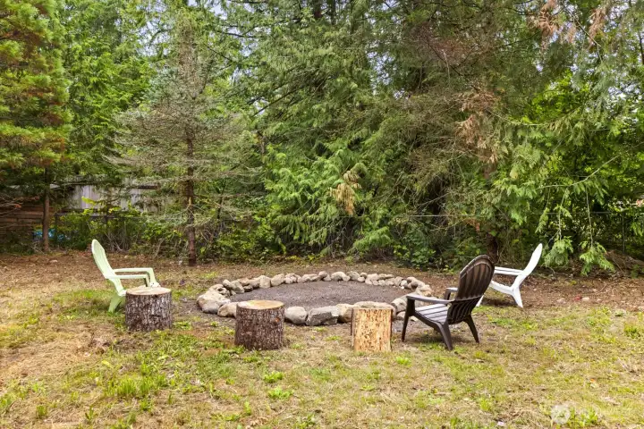 Expansive outdoor and hobby spaces with greenhouse and elk-proof garden area.