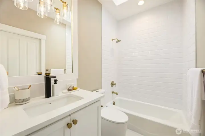 Endite bathroom connected to secondary bedroom.
